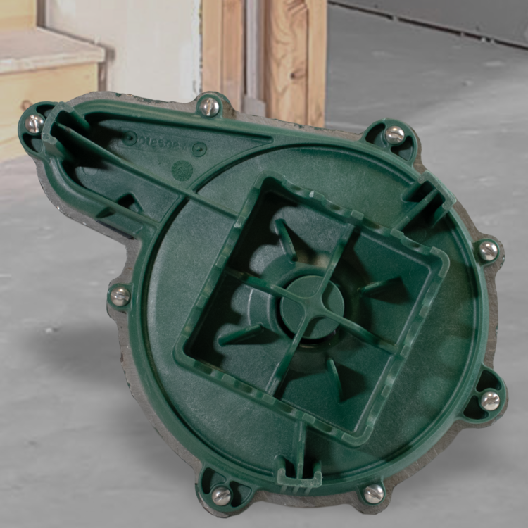 Green cast iron submersible pump housing with internal impeller and mounting bolt holes visible.