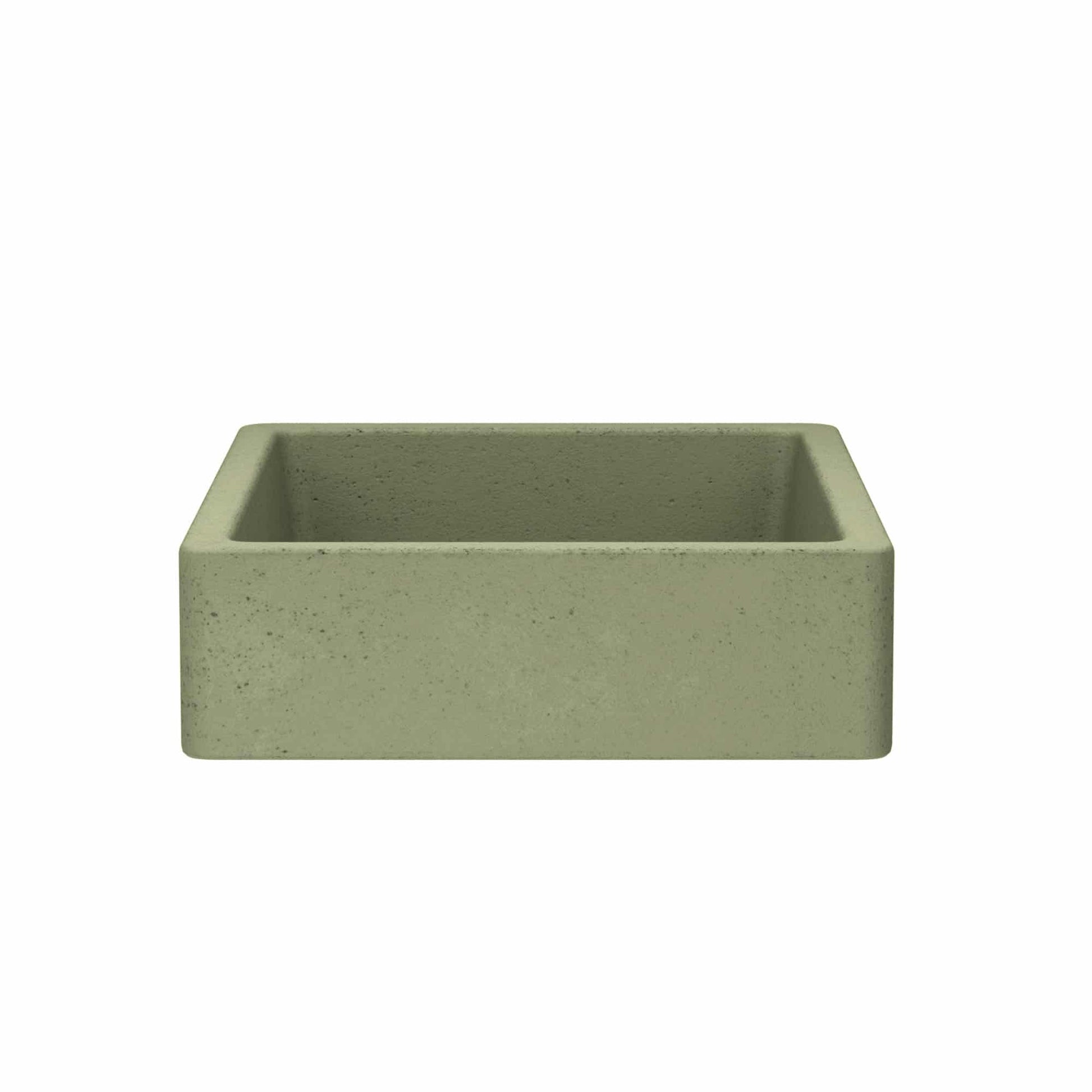 Sage green concrete apron-front sink with textured surface and rounded corners.
