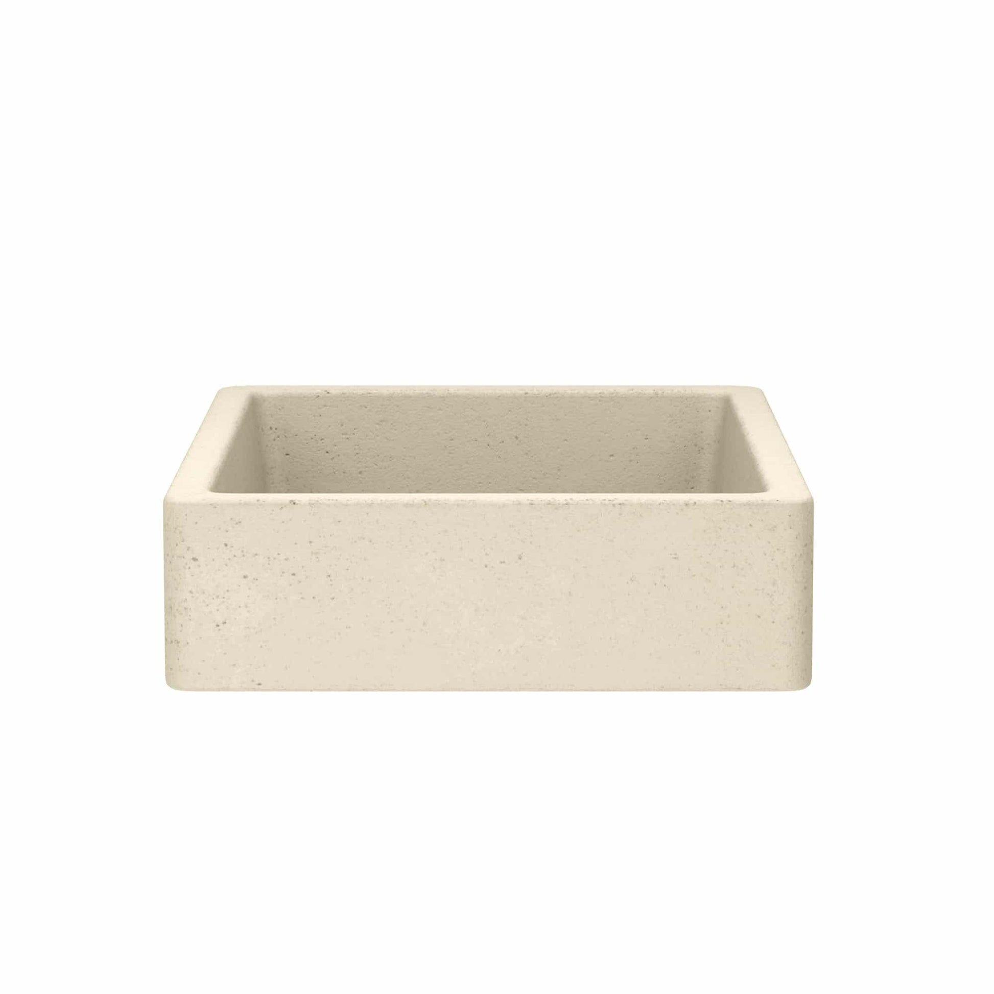 Rectangular concrete farmhouse sink in sand color with speckled finish and sloped interior walls.