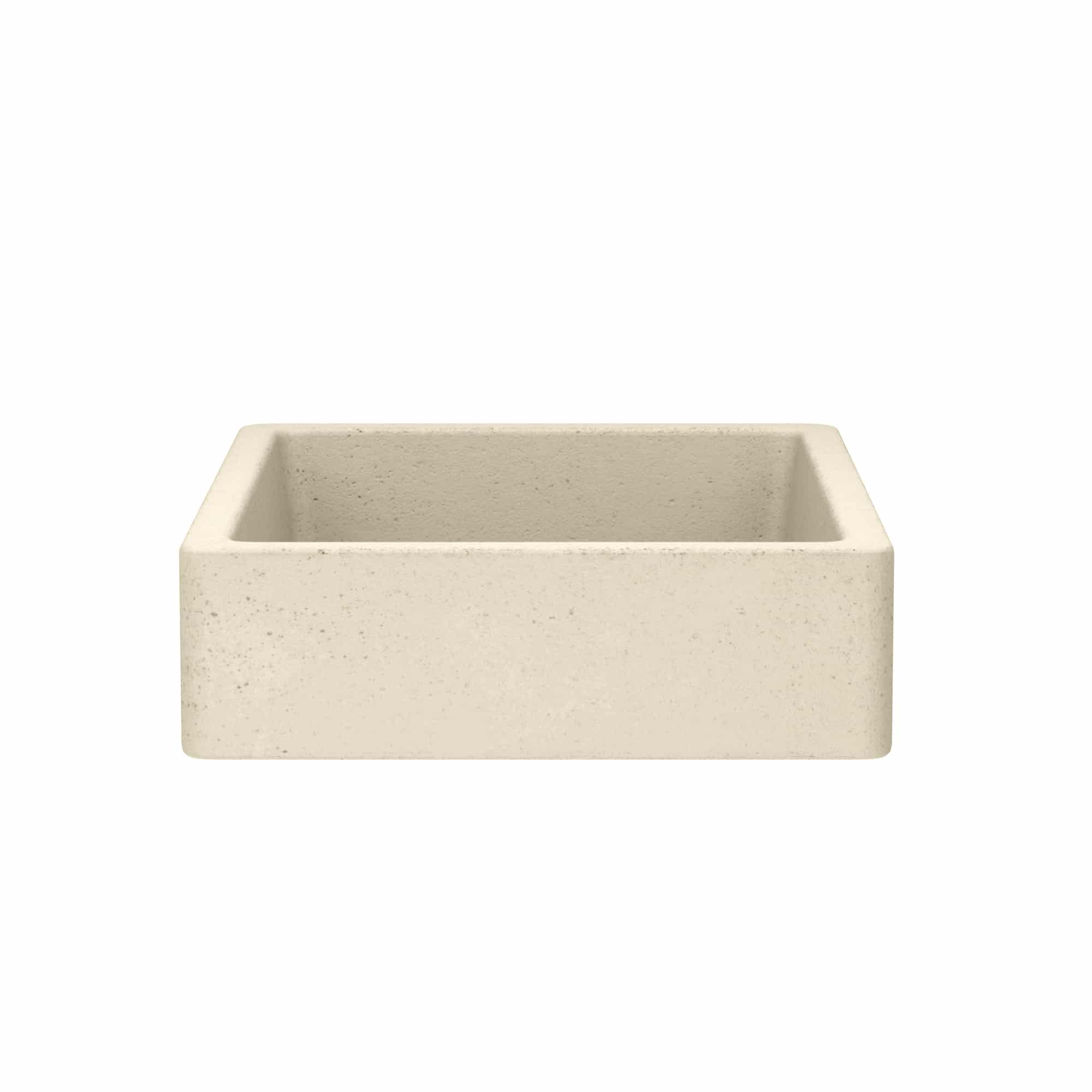 Rectangular concrete farmhouse sink in sand color with speckled finish and sloped interior walls.