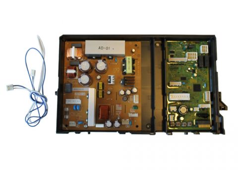 Noritz SHC71LF circuit control board with brown and green circuit panels, capacitors, and attached blue wire connector.