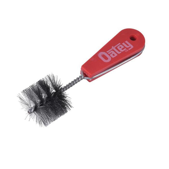 Red plastic-handled cleaning brush with black bristles and textured grip shaft.