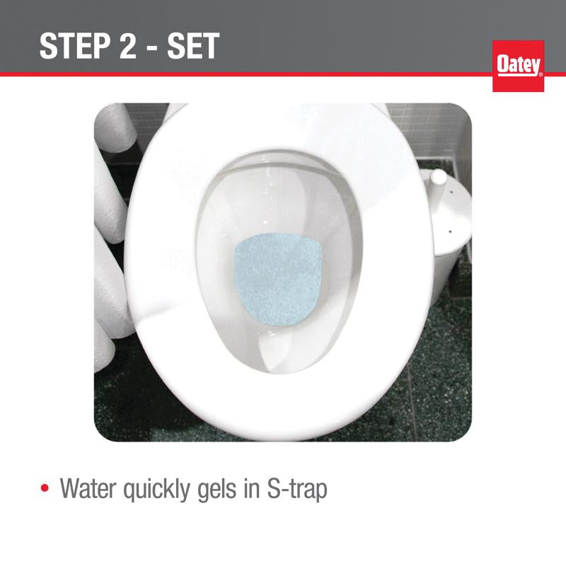 Blue gel product applied inside white toilet bowl during removal process.