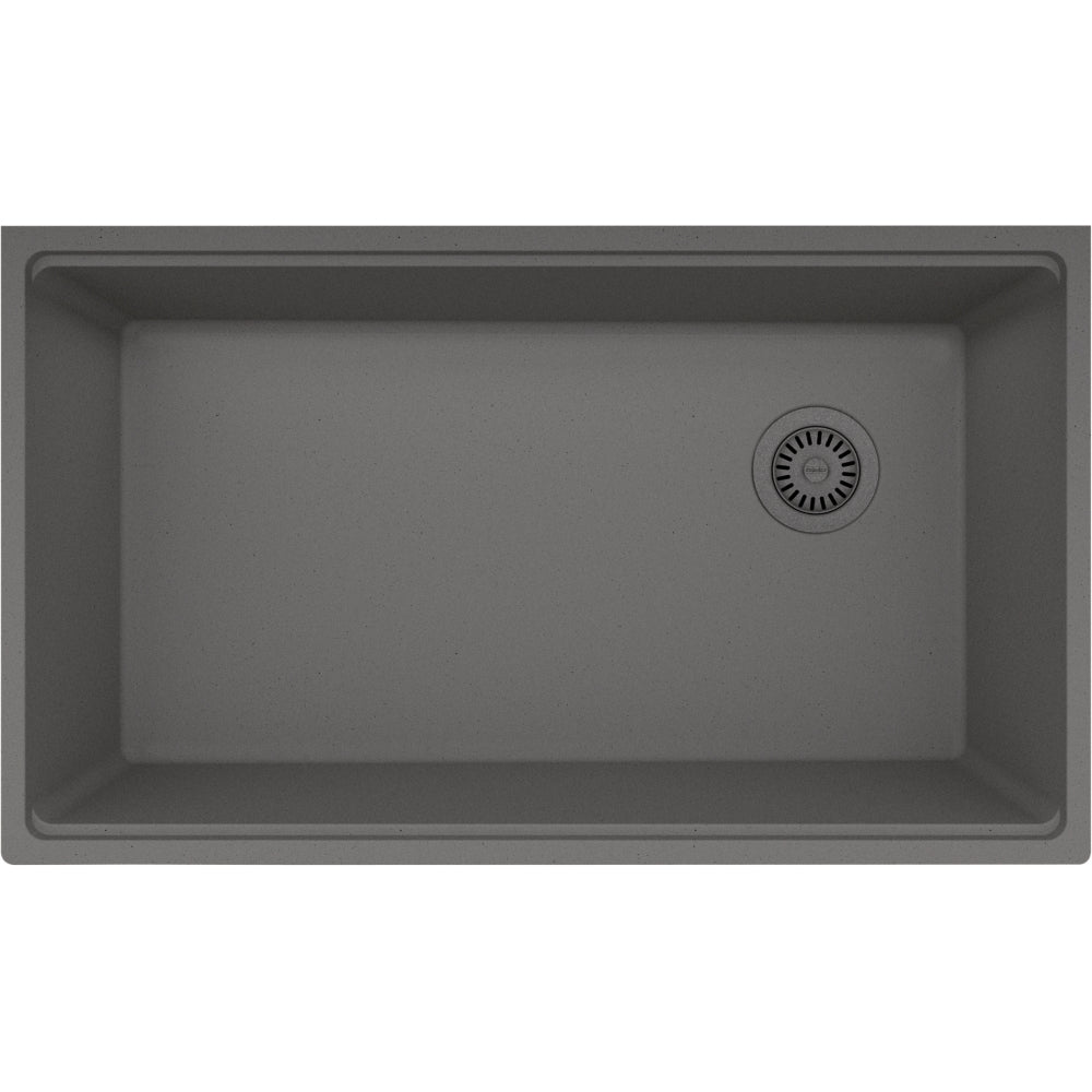 Stone grey granite single bowl undermount sink with drain basket in bottom right corner.