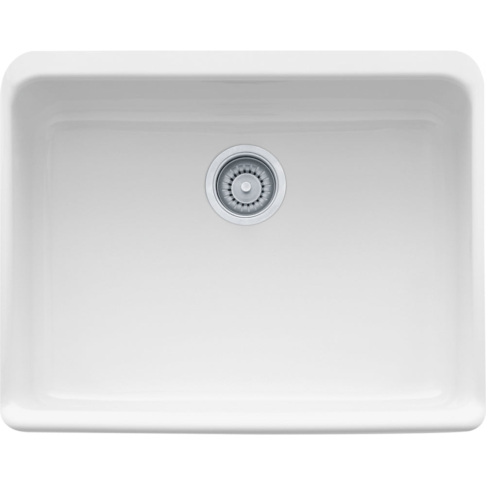 White fireclay single-bowl apron front sink with chrome drain strainer, viewed from above.