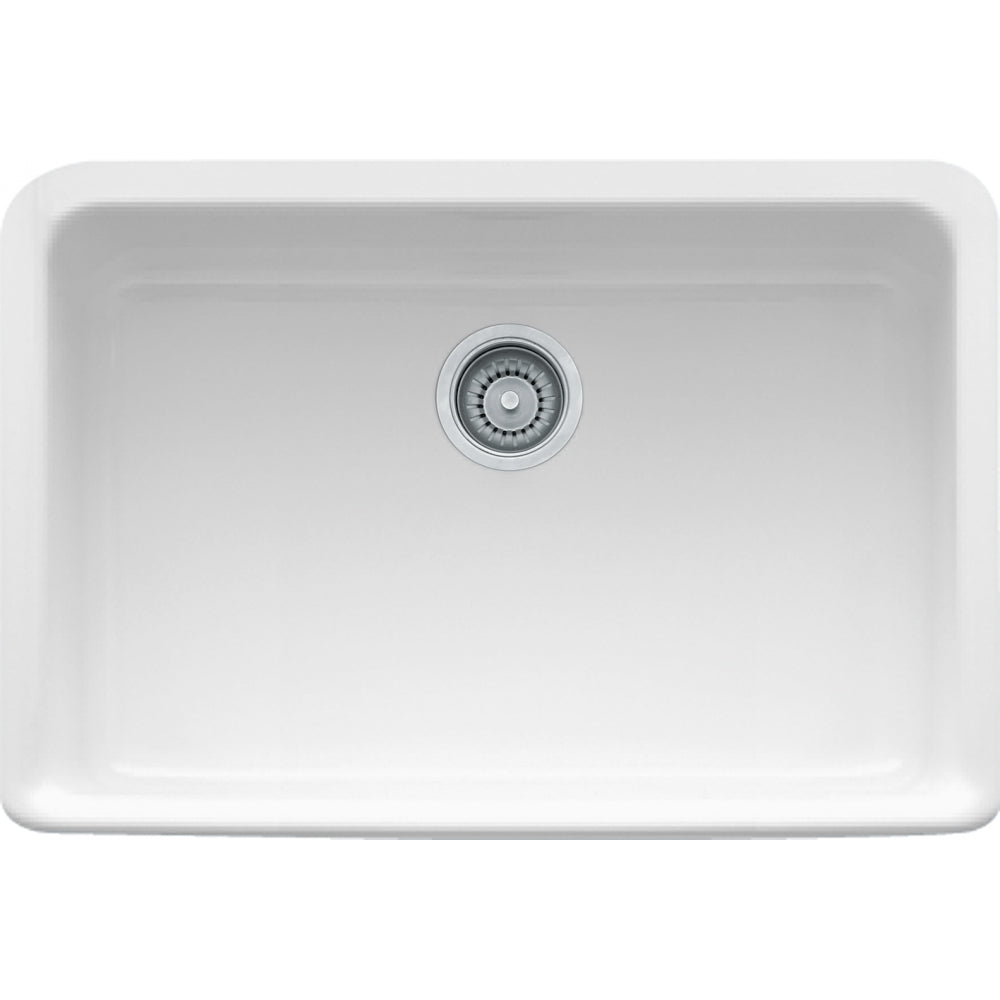 White fireclay apron front kitchen sink with single bowl and chrome drain strainer.