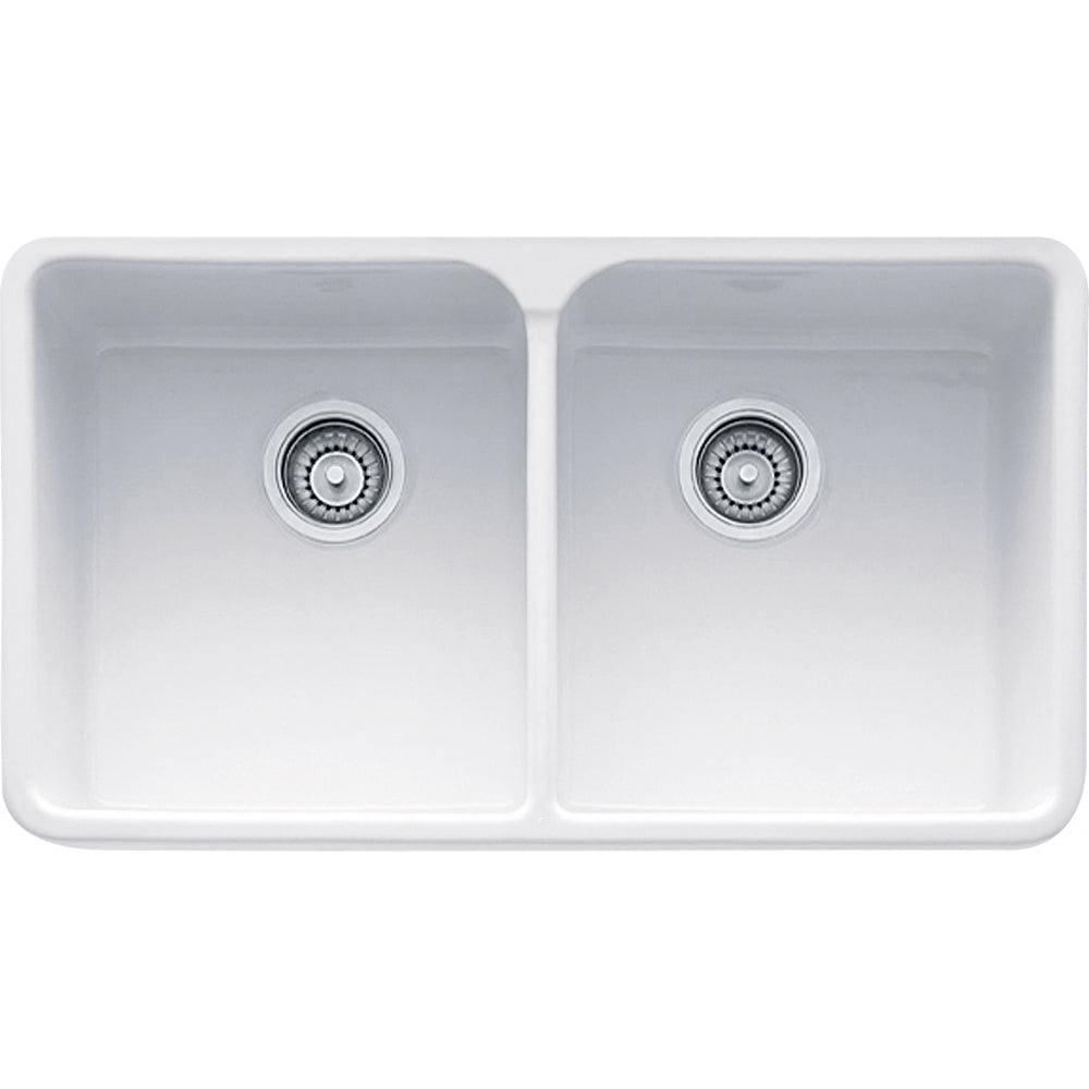 White fireclay apron front double bowl kitchen sink with chrome drain strainers.