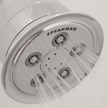 Polished chrome showerhead with multiple spray jets and "Speakman" branding visible on face.