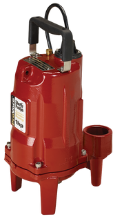 Red cylindrical grinder pump with black handle, discharge port, and three support feet.