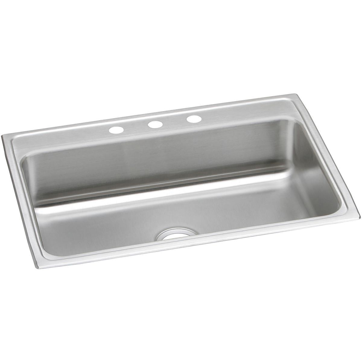 Stainless steel single bowl drop-in sink with three holes along the rim and drain opening visible.
