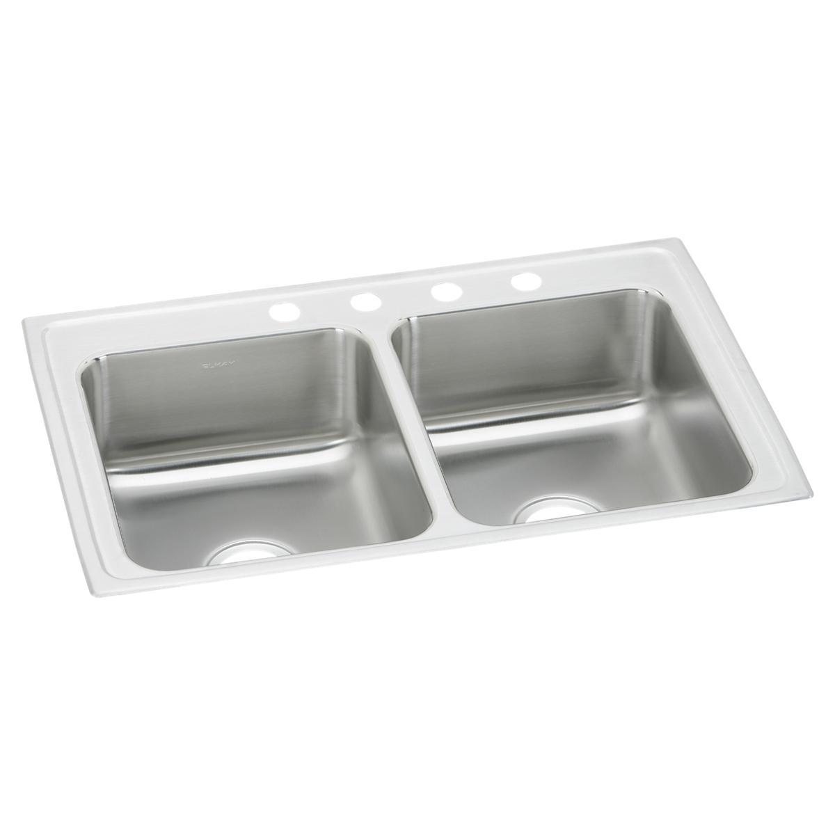 Stainless steel double bowl drop-in sink with white rim and four faucet holes across the top.