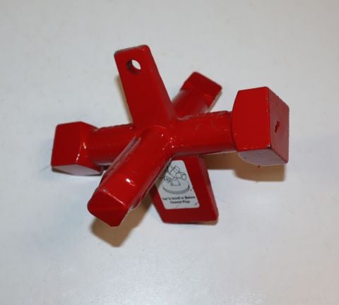 Red metal tub drain removal tool with multiple attachment heads and instruction label arranged in a display.
