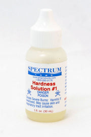 Spectrum Labs Hardness Solution #1 in clear plastic bottle with white dropper cap and yellow liquid inside.