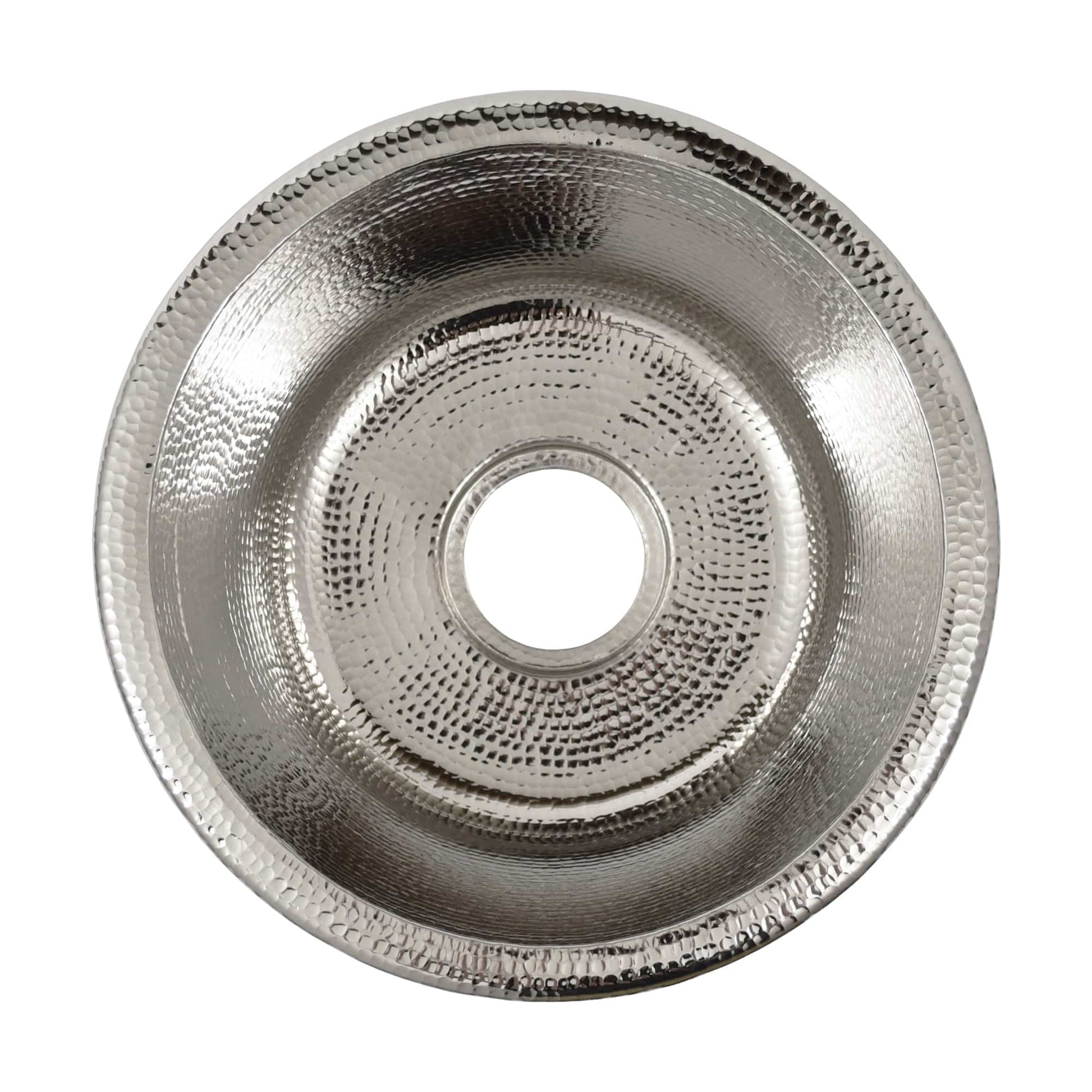 Polished nickel round sink with concentric hammered texture rings and center drain opening, viewed from above.