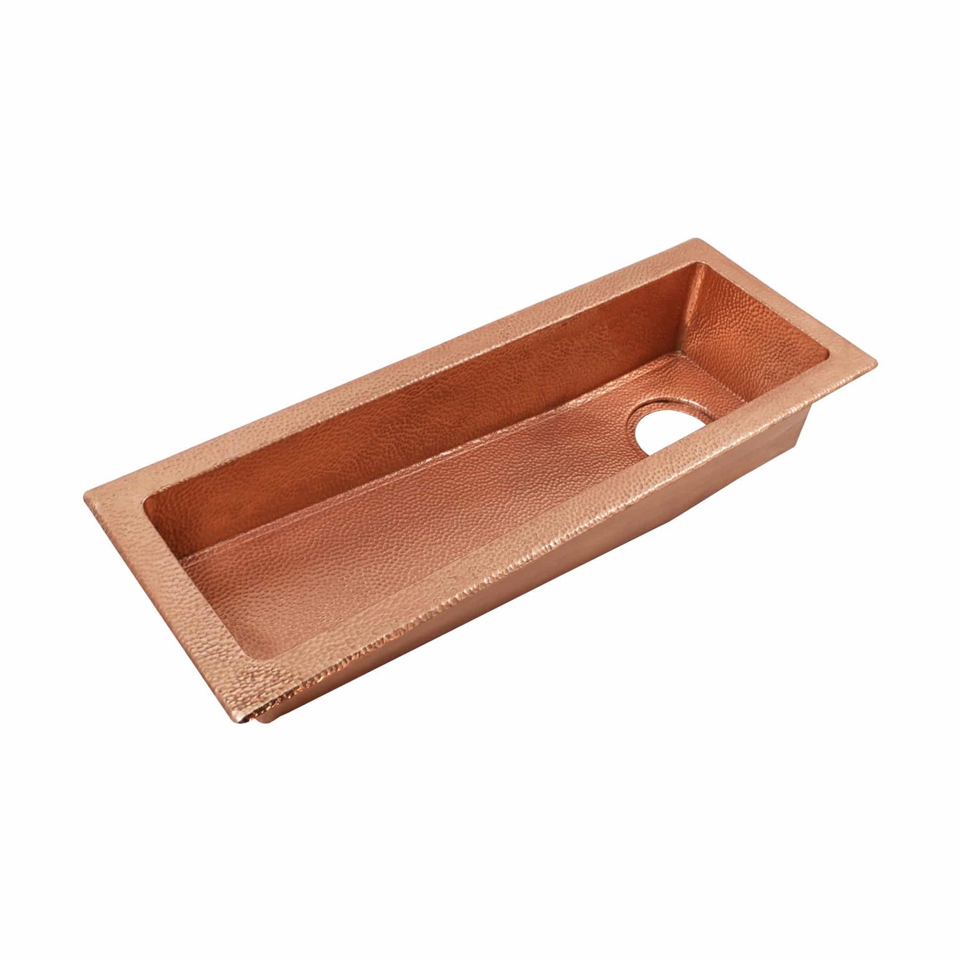 Polished copper rectangular sink with hammered texture and single drain hole on right side.