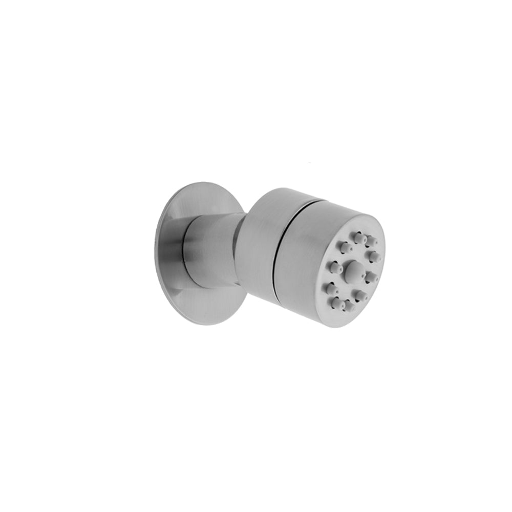 Polished chrome round body spray with multiple nozzle holes, mounted on circular wall plate.