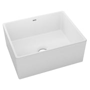 White fireclay farmhouse sink with single bowl and drain hole, front-facing installation.
