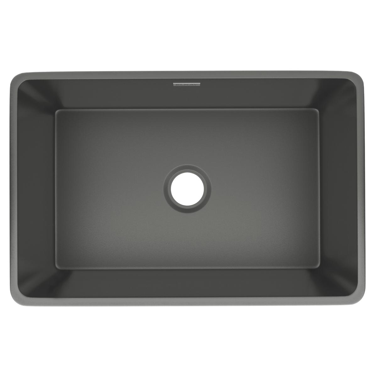 Gray fireclay farmhouse sink with single bowl and drain hole, viewed from above.