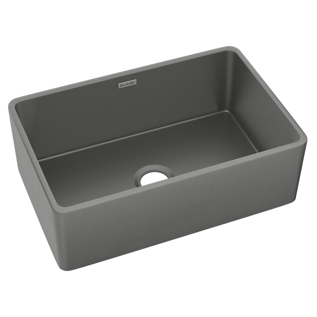 Gray fireclay single bowl farmhouse sink with rounded edges and drain hole.