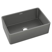 Gray fireclay single bowl farmhouse sink with rounded edges and drain hole.