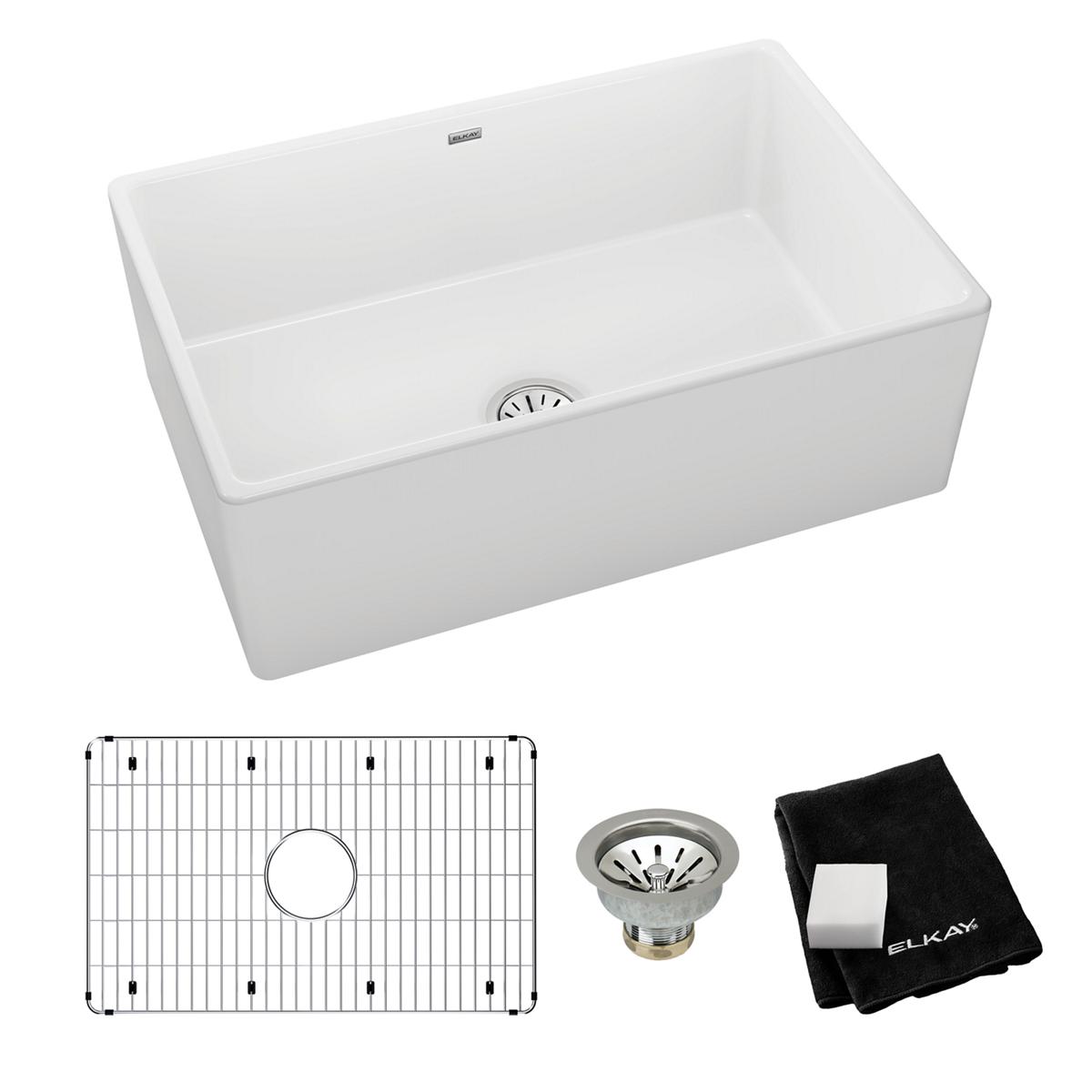 White fireclay single-bowl farmhouse sink with grid strainer, drain basket, and cleaning cloth included.