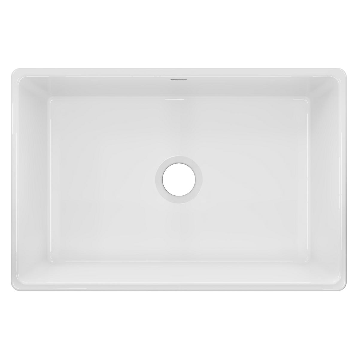White fireclay farmhouse sink with single bowl and rounded corners, shown from above.
