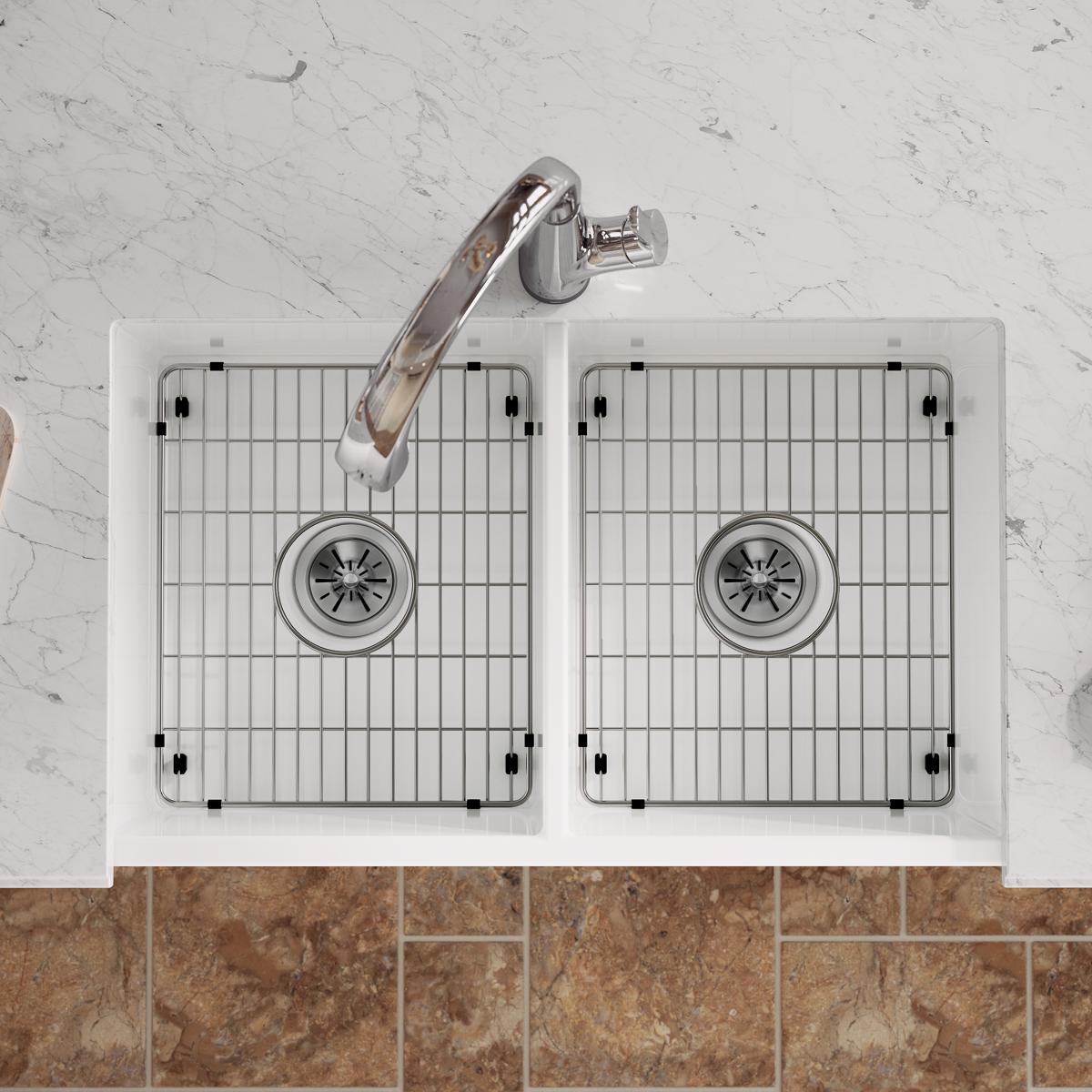 White fireclay farmhouse sink with two equal bowls, stainless steel grids, and chrome filtered faucet with wood handle, viewe