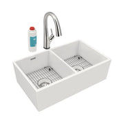 White fireclay farmhouse sink with two equal bowls, chrome pull-down faucet, grid strainers, and filtered water cartridge.