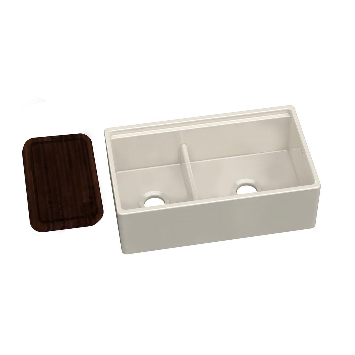 Dark wood cutting board positioned next to a white double-basin sink with divider.
