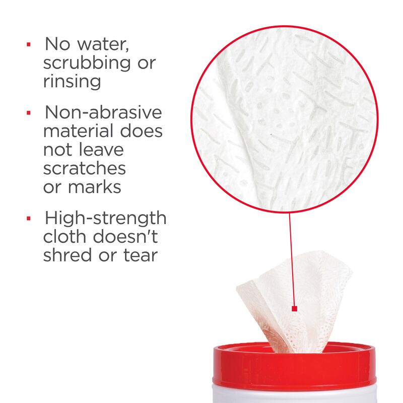 White pre-moistened towel dispensed from red and white container with closeup of textured cloth material.