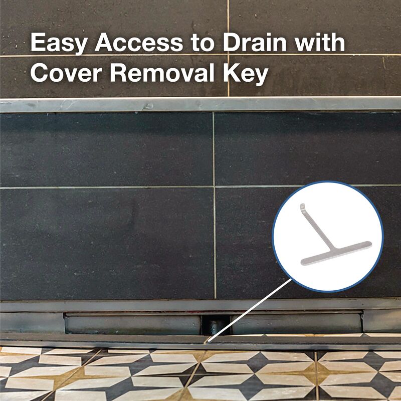 Stainless steel wall drain installed in dark tile wall with removal key tool shown in circular inset.