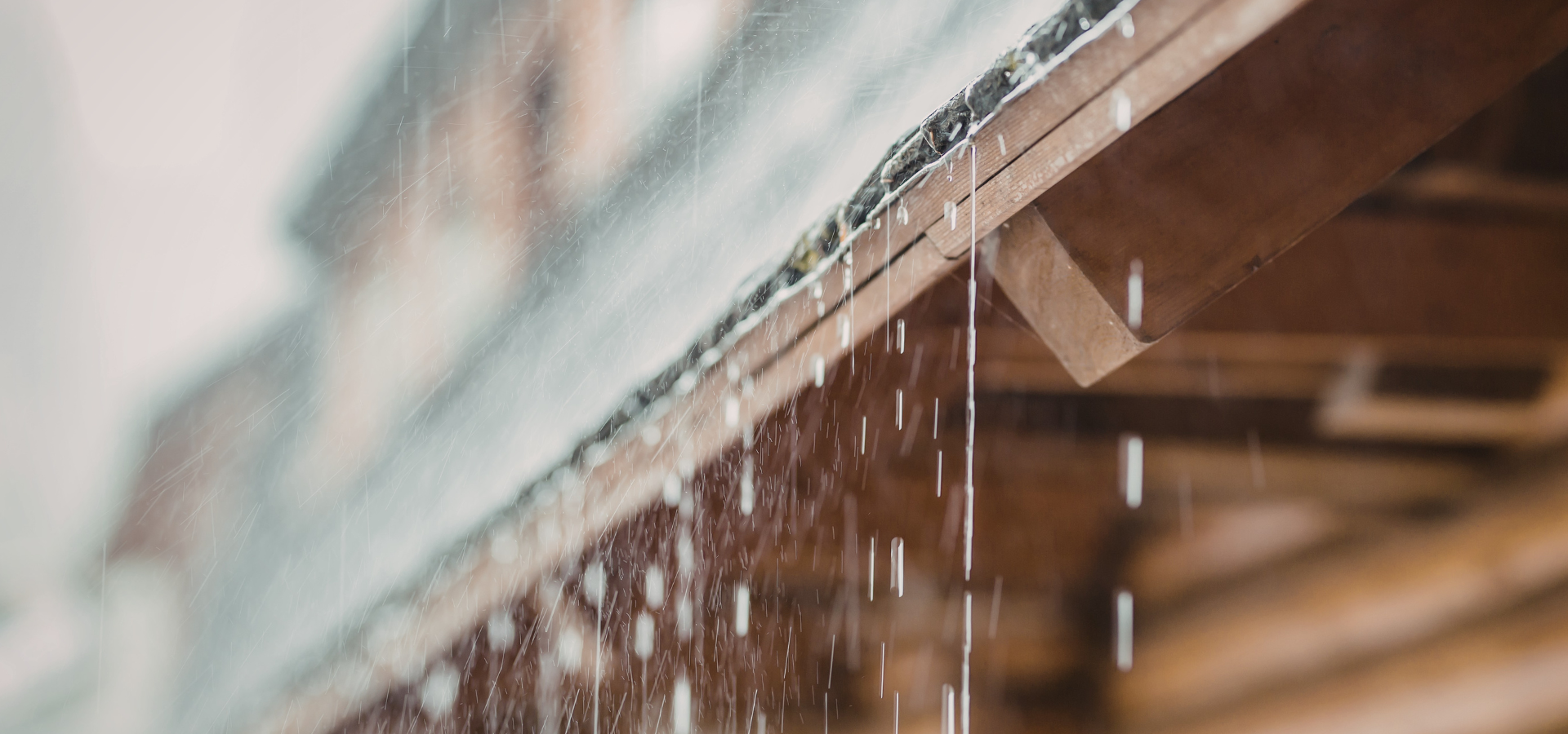 Rainwater dripping from a roof