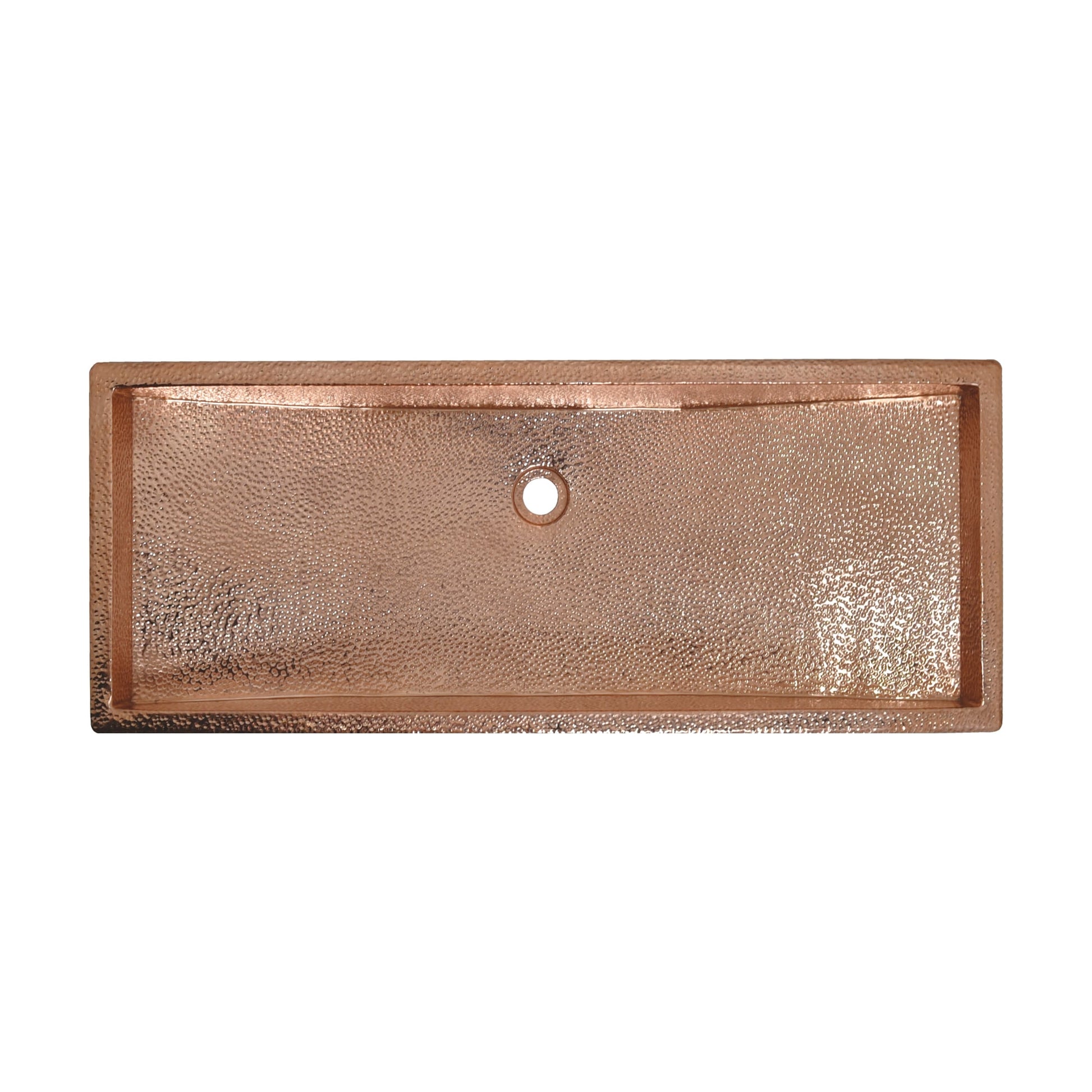 Polished copper rectangular trough sink with hammered interior surface and single drain hole.
