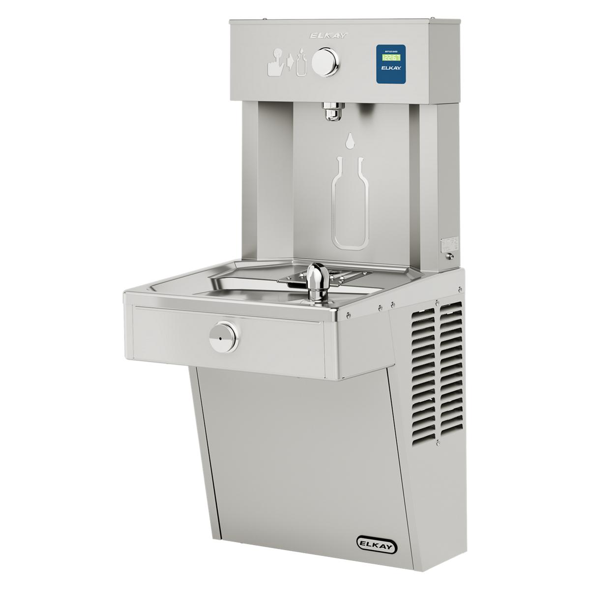 Stainless steel Elkay water station with bottle filling spout at top, drinking fountain basin below, and cooler unit at base.
