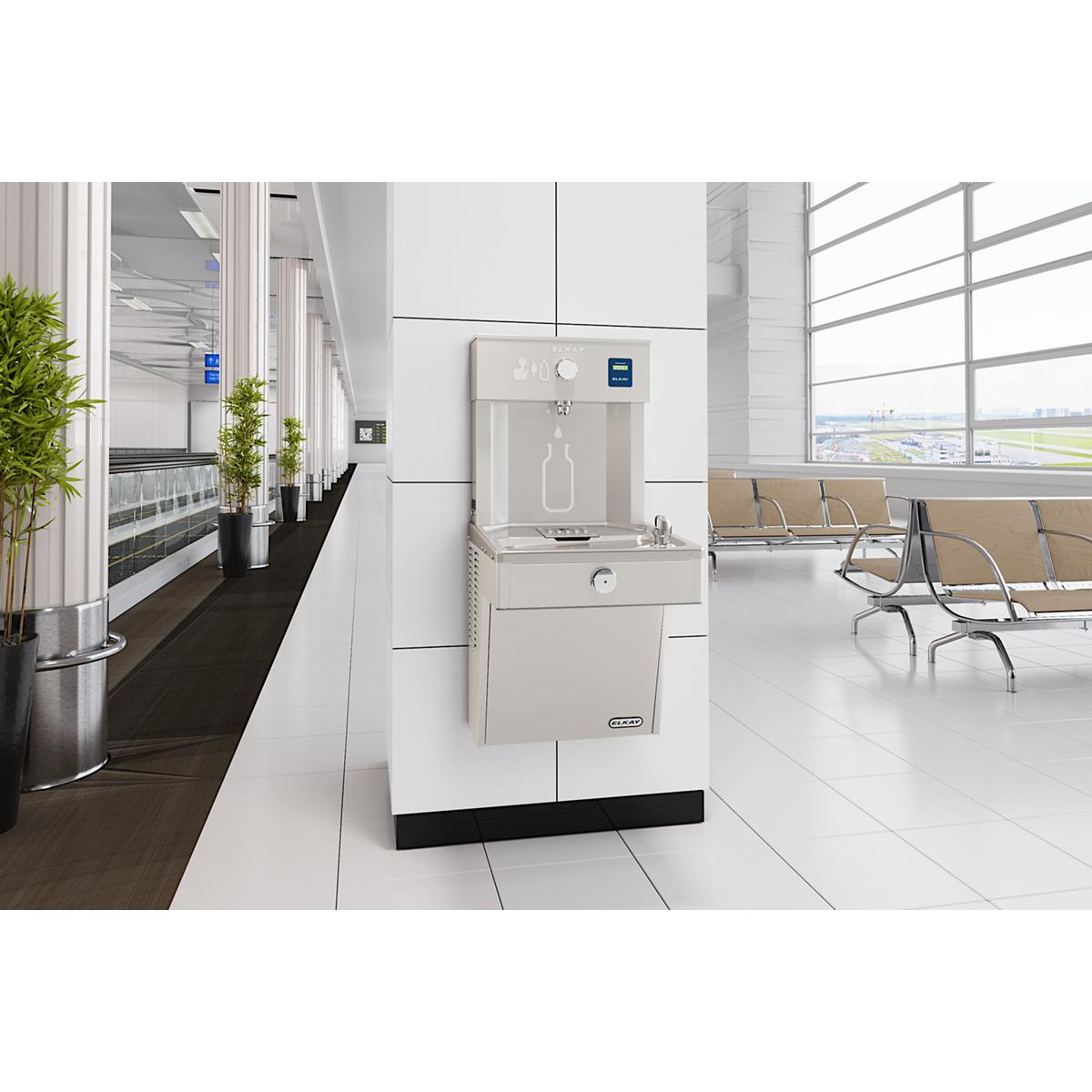 Stainless steel wall-mounted water filling station with bottle filler spout and single cooler basin in modern institutional s