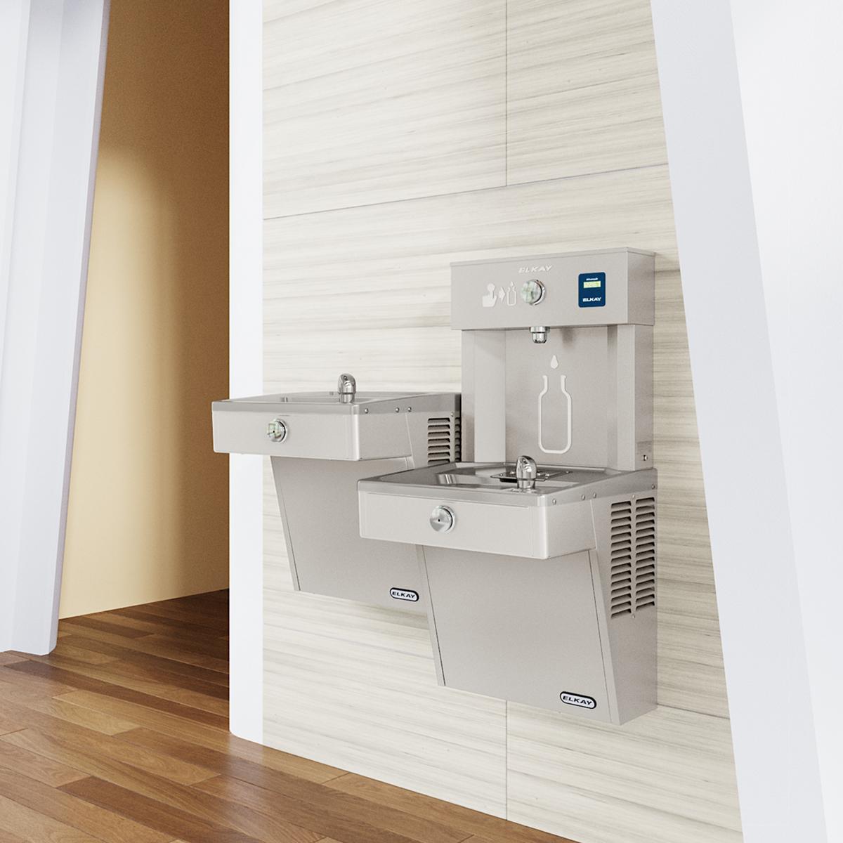Stainless steel wall-mounted bi-level water cooler and bottle filling station with refrigeration unit in an institutional hal