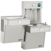 Stainless steel water cooler and bottle filling station with bi-level basin configuration and wall-mounted dispenser unit.