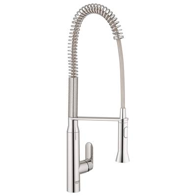 Chrome kitchen faucet with single handle, coiled pull-out spray head, and tall arched spout.