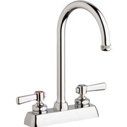 Chrome workboard sink faucet with dual lever handles and tall curved spout over white base.