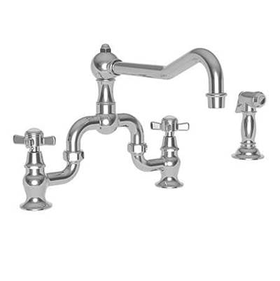 Satin nickel kitchen faucet with curved spout, two cross handles, and separate side spray attachment.