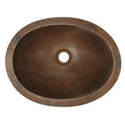 Oval hammered copper bathroom sink with single drain hole, viewed from above.