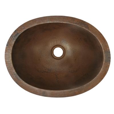 Oval hammered copper bathroom sink with single drain hole, viewed from above.