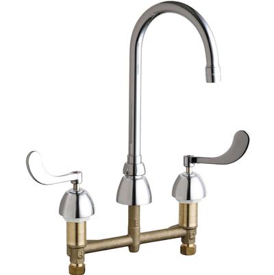 Chrome and brass kitchen sink faucet with curved spout and two wrist handles.
