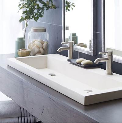 Pearl white rectangular trough bathroom sink with two faucet holes and chrome fixtures.