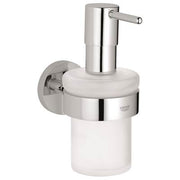 Chrome soap dispenser with white ceramic container and wall-mounted holder with pump mechanism.