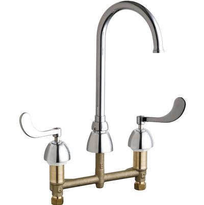Chrome and brass kitchen sink faucet with curved spout and two wrist handles on deck mount base.