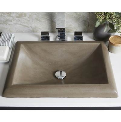 Rectangular earth-tone concrete bathroom sink with single drain hole and chrome faucet mounted on white countertop.