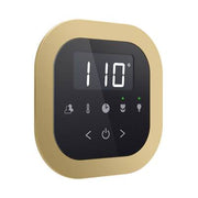 Satin brass round flush mount steam shower control panel with digital display showing 110 degrees and touch buttons.
