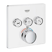 Chrome thermostatic shower trim with white square plate, three control knobs above large central dial, Grohe branding visible