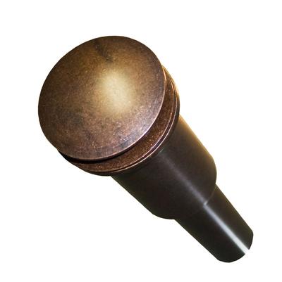 Weathered copper dome drain with dark metal tube base.